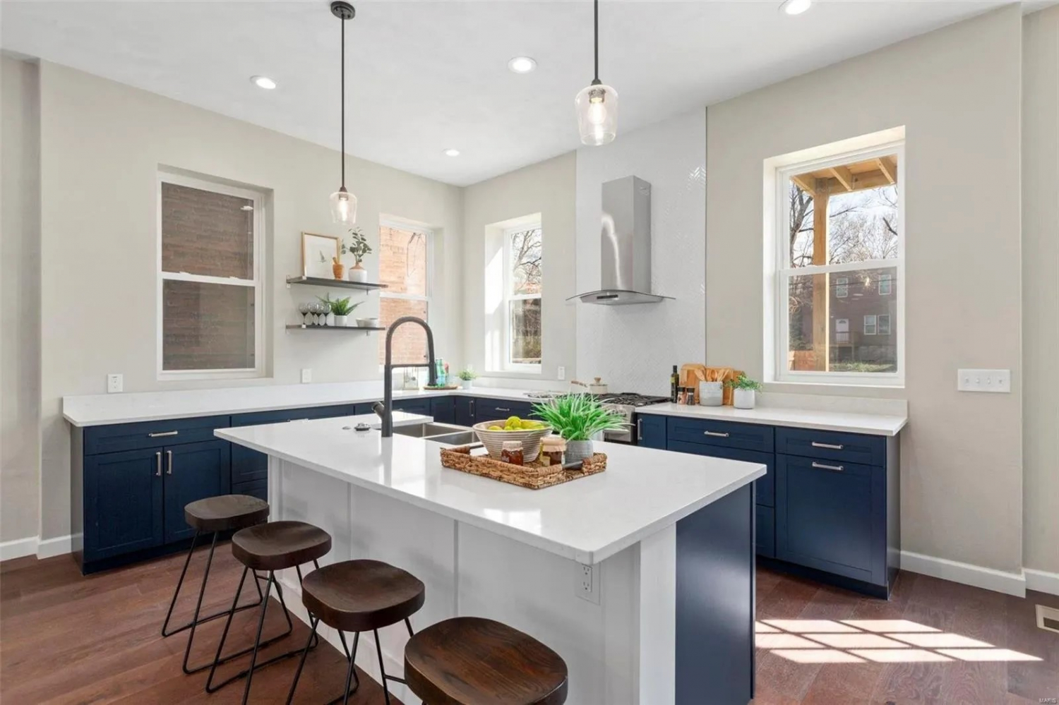 Carrara Morro Quartz Countertops on Navy Titan Granite