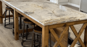 Kitchen island with quartz countertops and bar stools